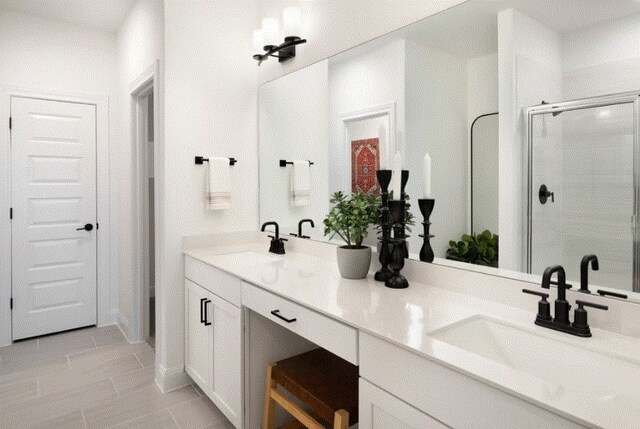 bathroom with vanity and an enclosed shower