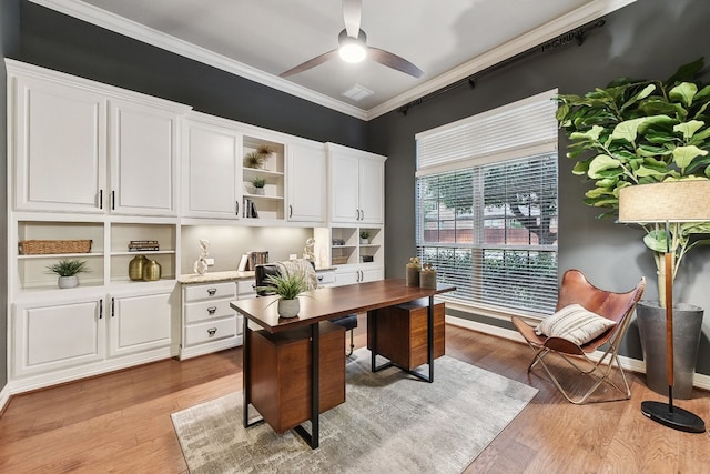 office space with ceiling fan, ornamental molding, and light hardwood / wood-style flooring