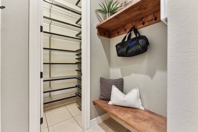 mudroom featuring light tile patterned flooring