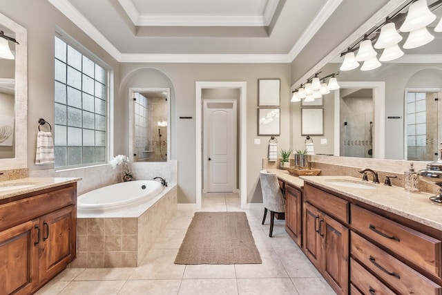 bathroom with vanity, crown molding, and shower with separate bathtub