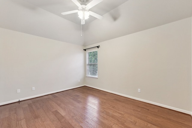 spare room featuring ceiling fan, vaulted ceiling, and hardwood / wood-style floors