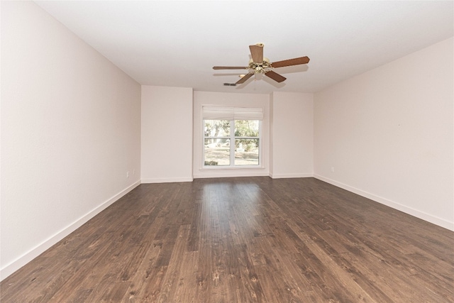 empty room featuring dark hardwood / wood-style floors and ceiling fan