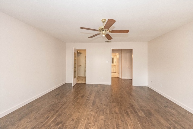 unfurnished room with ceiling fan and dark hardwood / wood-style floors