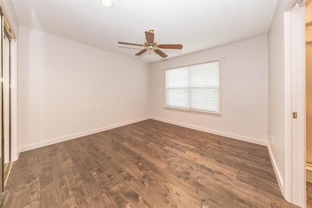 unfurnished room with dark hardwood / wood-style floors and ceiling fan