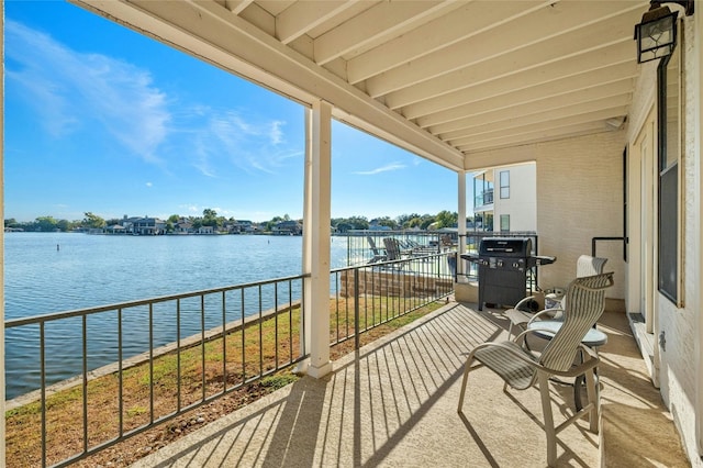 balcony featuring a grill and a water view