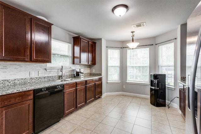 kitchen with black dishwasher, sink, hanging light fixtures, and plenty of natural light