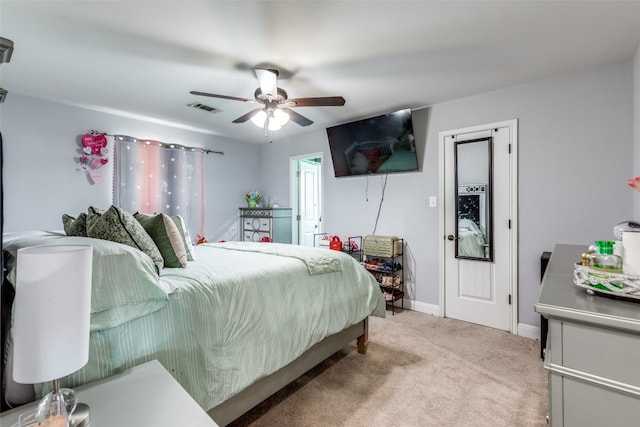 bedroom featuring light carpet and ceiling fan