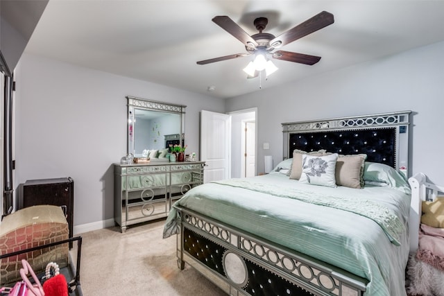 bedroom with light colored carpet and ceiling fan