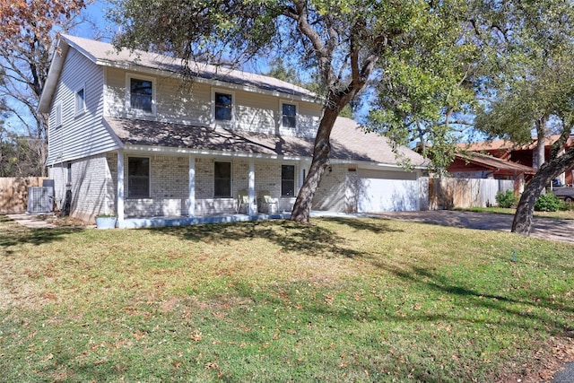 view of front of property featuring cooling unit and a front lawn