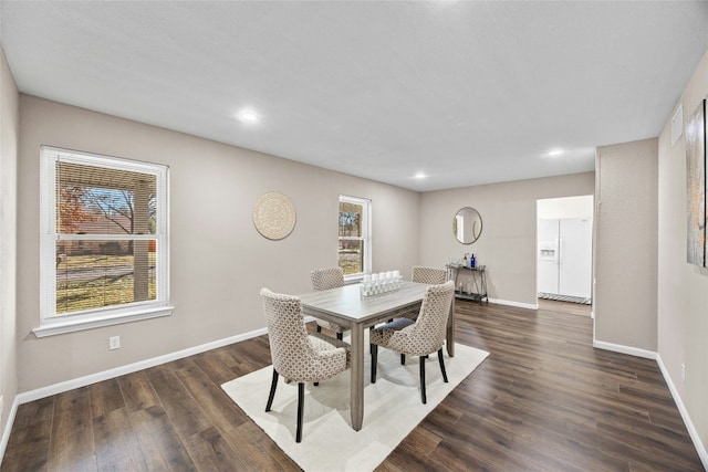 dining space with dark wood-type flooring