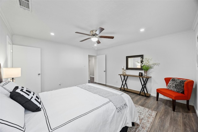 bedroom with ceiling fan, crown molding, and dark wood-type flooring