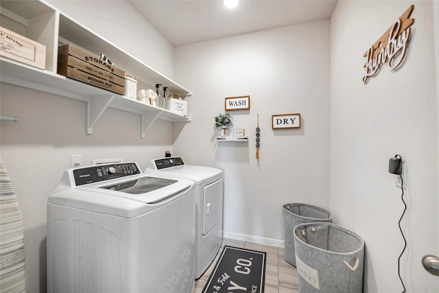 laundry room with separate washer and dryer