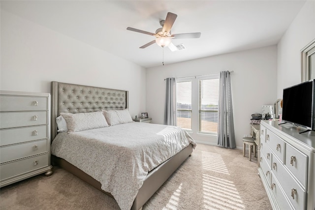 bedroom featuring light carpet and ceiling fan