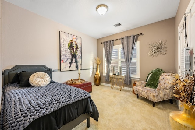 bedroom featuring light carpet