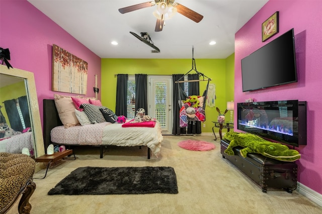 bedroom with ceiling fan and light colored carpet