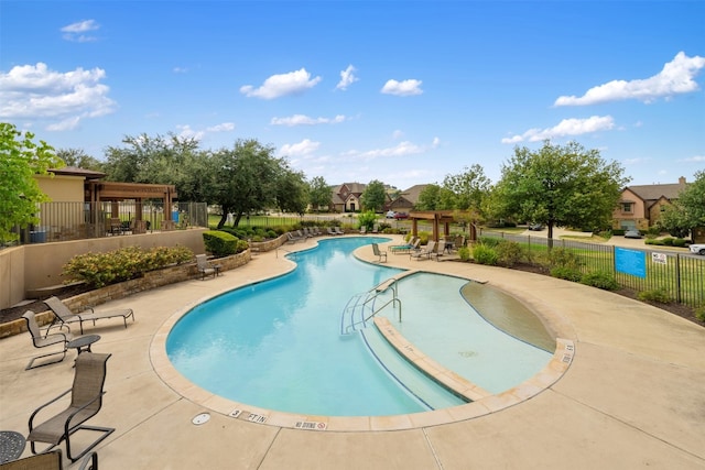 view of swimming pool with a pergola and a patio area