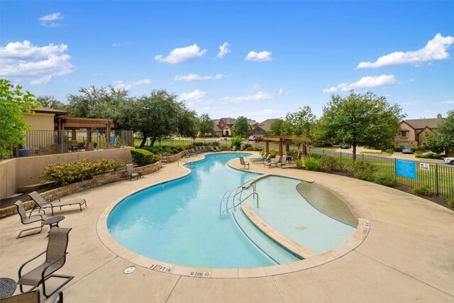 335 Lombardia Dr Unit 19E, Austin, TX 78734 - pool with a patio area, fence, and a pergola