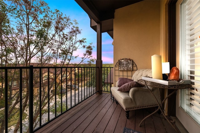 view of balcony at dusk