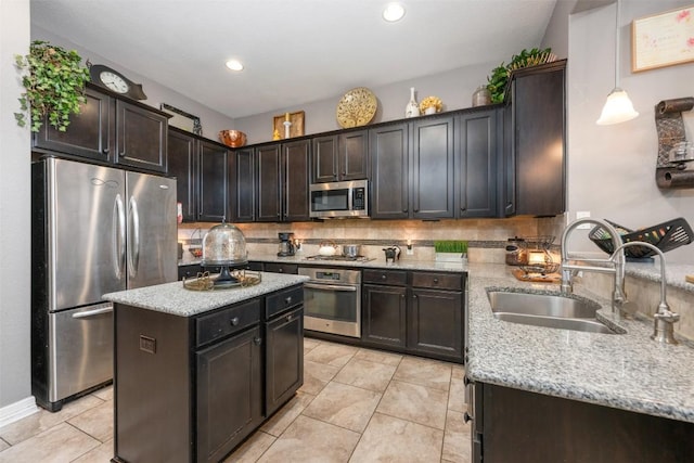 335 Lombardia Dr Unit 19E, Austin, TX 78734 - kitchen with stainless steel appliances, light stone counters, a sink, and tasteful backsplash