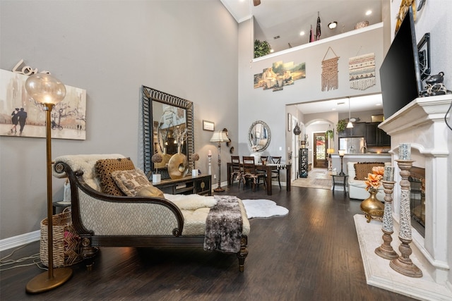 interior space featuring hardwood / wood-style flooring and a towering ceiling