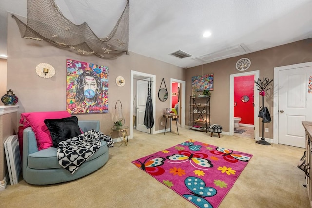 335 Lombardia Dr Unit 19E, Austin, TX 78734 - recreation room featuring carpet floors, attic access, baseboards, and visible vents