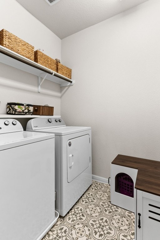 laundry room with washer and dryer