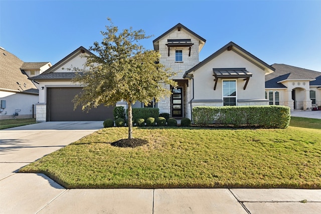 view of front facade with a front lawn and a garage