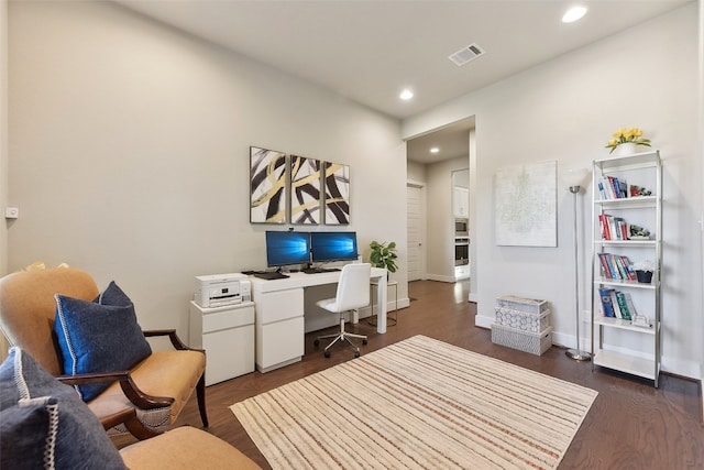 office space with dark hardwood / wood-style floors