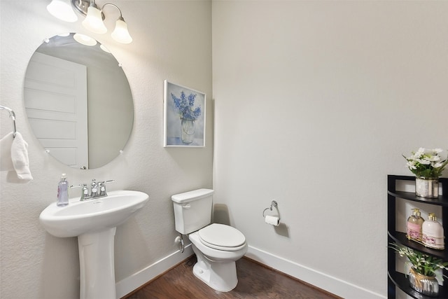 bathroom featuring toilet and hardwood / wood-style floors