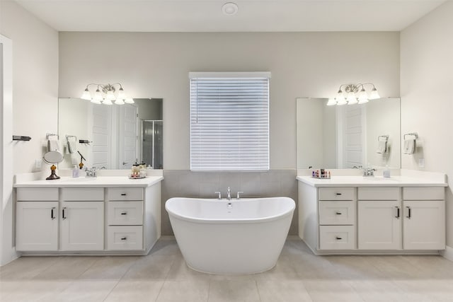 bathroom with vanity, plus walk in shower, and tile patterned floors