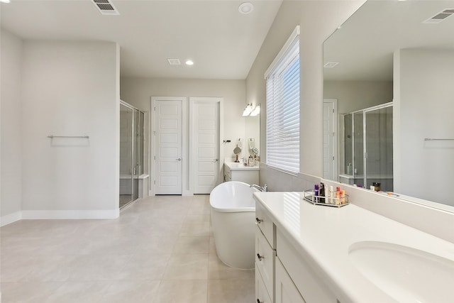 bathroom with vanity, independent shower and bath, and tile patterned flooring