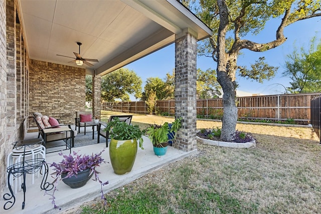 view of yard featuring a patio and ceiling fan