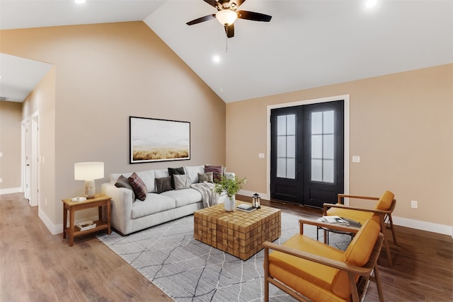 living room featuring french doors, high vaulted ceiling, light hardwood / wood-style floors, and ceiling fan