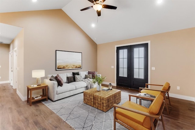 427 E Castleshoals Dr, Granite Shoals, TX 78654 - living area with high vaulted ceiling, a ceiling fan, french doors, wood finished floors, and baseboards