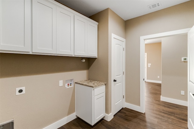 clothes washing area featuring hookup for a washing machine, cabinets, hookup for an electric dryer, and dark hardwood / wood-style floors