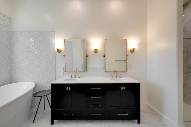 bathroom with vanity, a tub to relax in, and tile walls