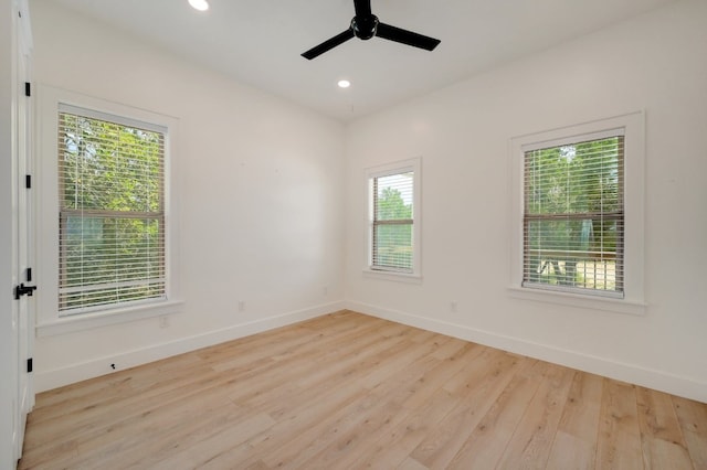 unfurnished room with light hardwood / wood-style flooring and plenty of natural light