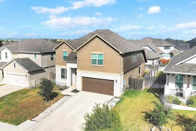 view of front of house with a front yard and a garage