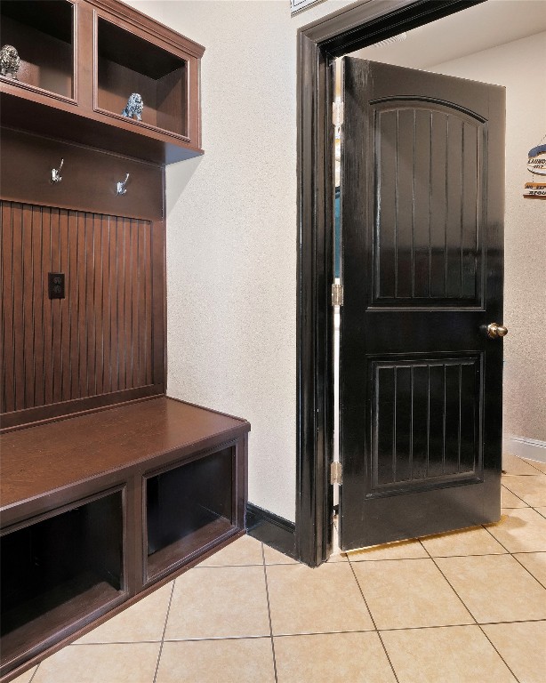 mudroom with light tile patterned flooring