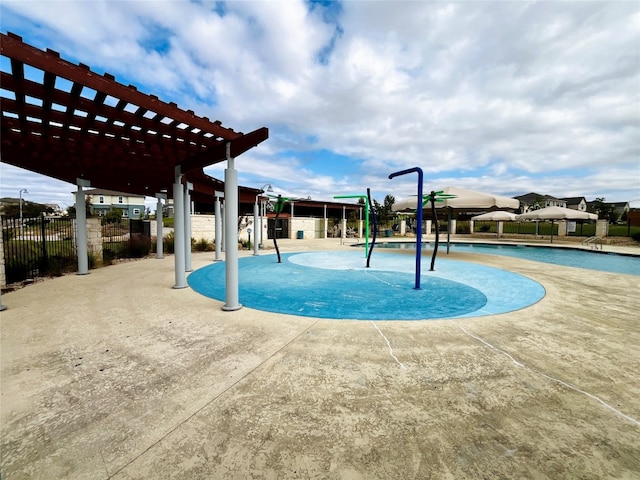 view of swimming pool with a patio