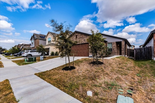 view of front of property featuring a front lawn and a garage