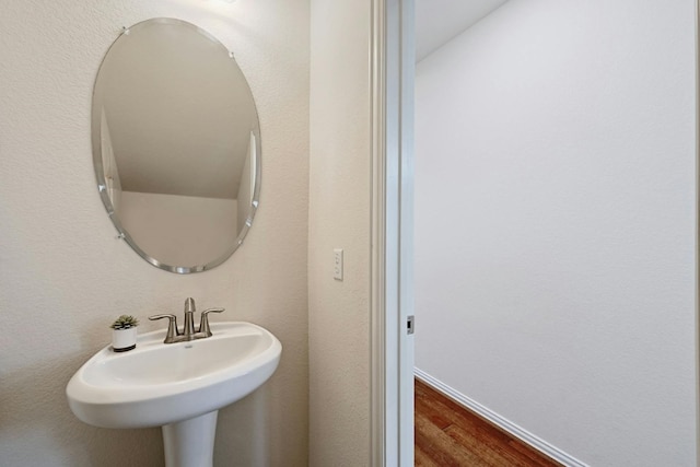 bathroom featuring hardwood / wood-style floors and sink