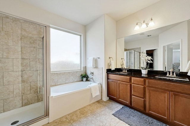 bathroom featuring tile patterned flooring, vanity, and independent shower and bath