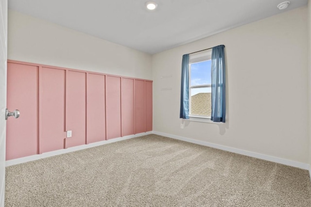 spare room featuring carpet floors