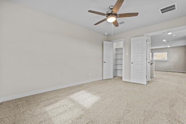 unfurnished bedroom with ceiling fan and light carpet