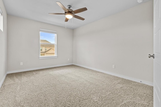 unfurnished room with ceiling fan and carpet floors