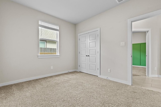 unfurnished bedroom with carpet