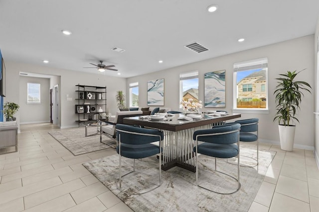 dining area with ceiling fan, a healthy amount of sunlight, and light tile patterned flooring