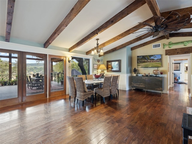 dining area featuring lofted ceiling with beams, ceiling fan with notable chandelier, and hardwood / wood-style floors