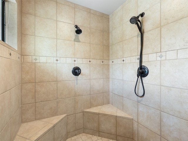 bathroom featuring tiled shower